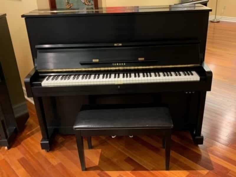 Beautifully refurbished 1969 48” model U1 piano and matching bench in matte black finish including humidity control system